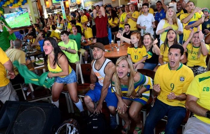 Brazilian fans watching the World Cup at the Tropical Cafe in Framingham, June 2014. Courtesy of the Milford Daily News